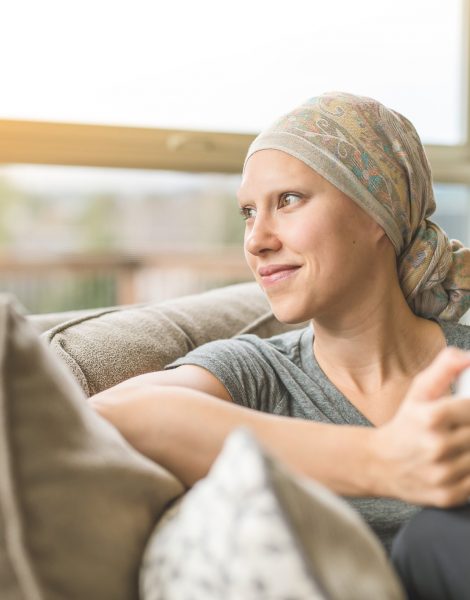 Ethnic Young Adult Female Cancer Patient Sipping Tea