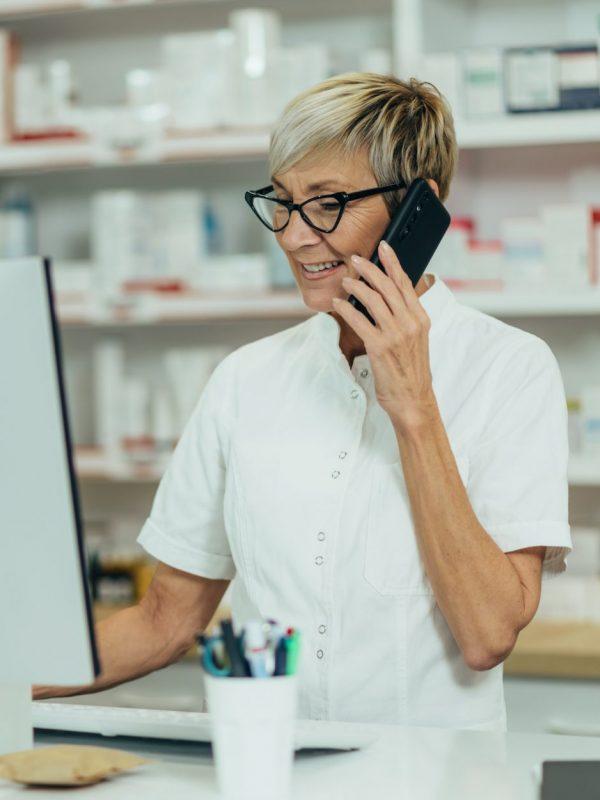 Portrait Of A Beautiful Senior Female Pharmacist Working In A Pharmacy